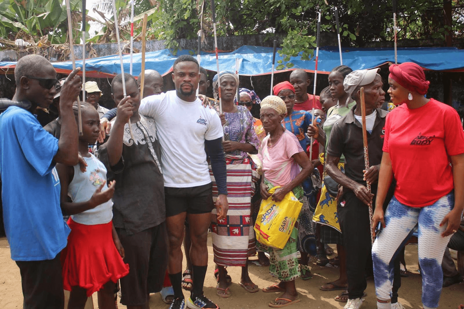 Abel Gebor with community members in Liberia
